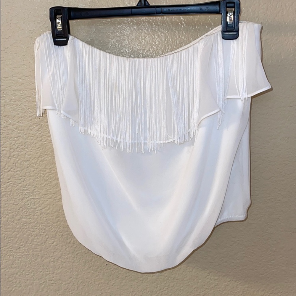 Cute white Bebe off shoulder top with tassels